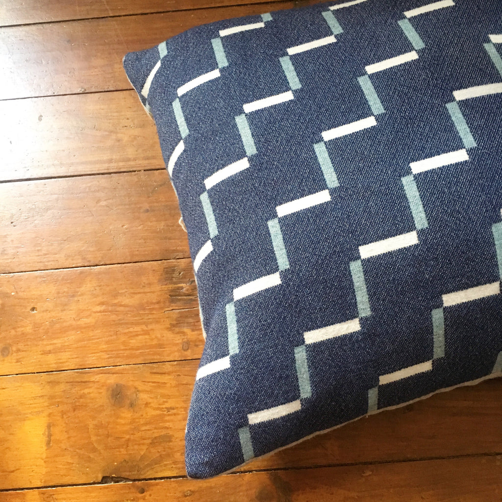 Contemporary, navy blue cushion. Merino wool, woven in England.