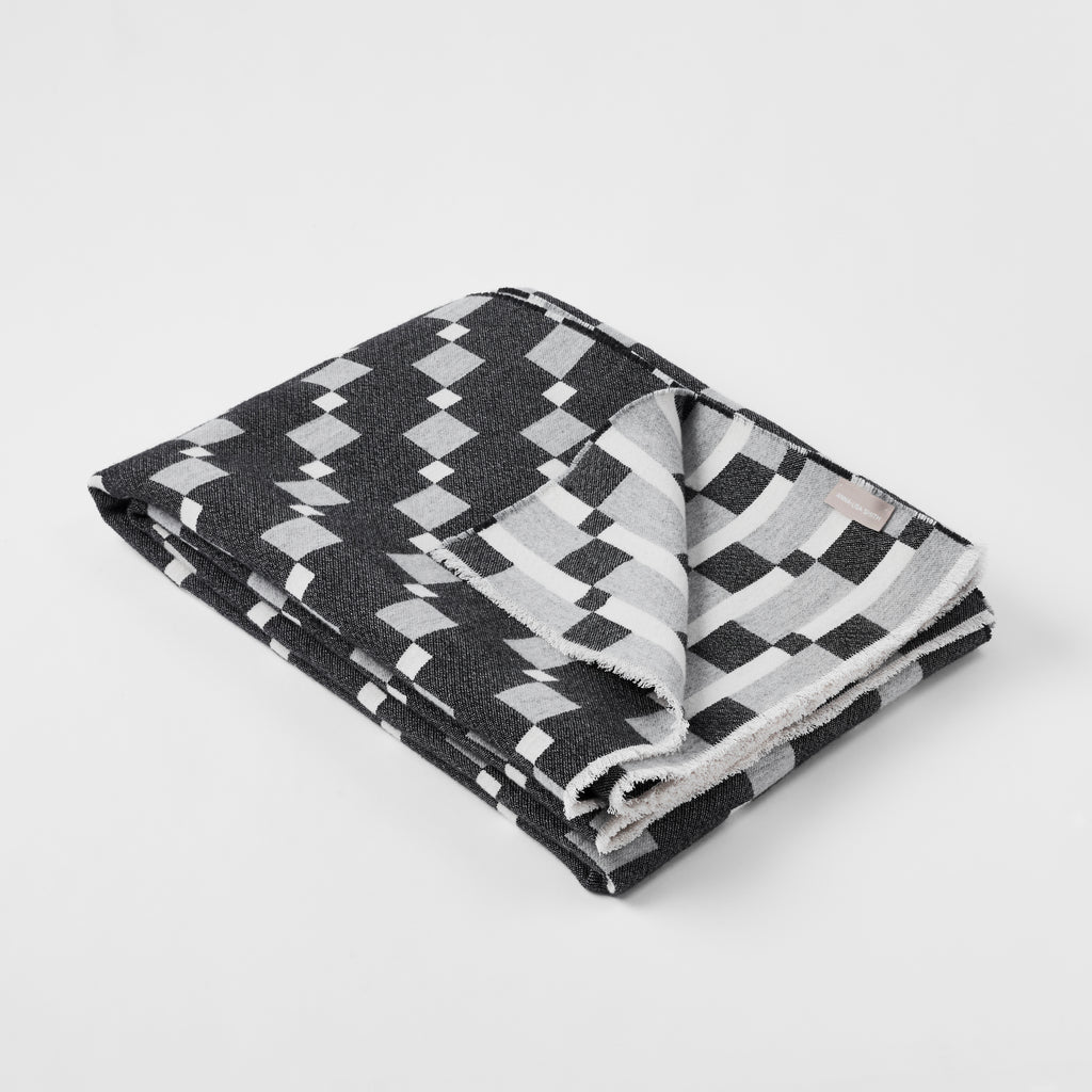 Contemporary , monochrome, merino wool blanket  woven in England, perfect for sofa or bed.