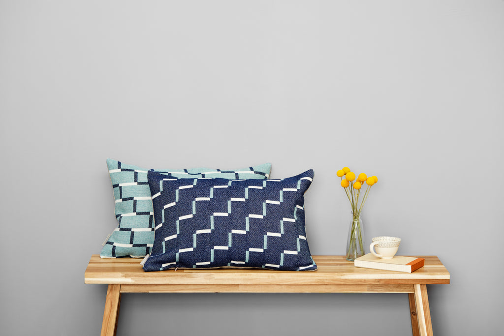 Contemporary merino wool cushion, teal and navy blue. Woven in England.