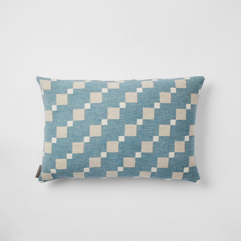 Contemporary merino wool cushions woven in England in a beautiful soft shade of Teal.