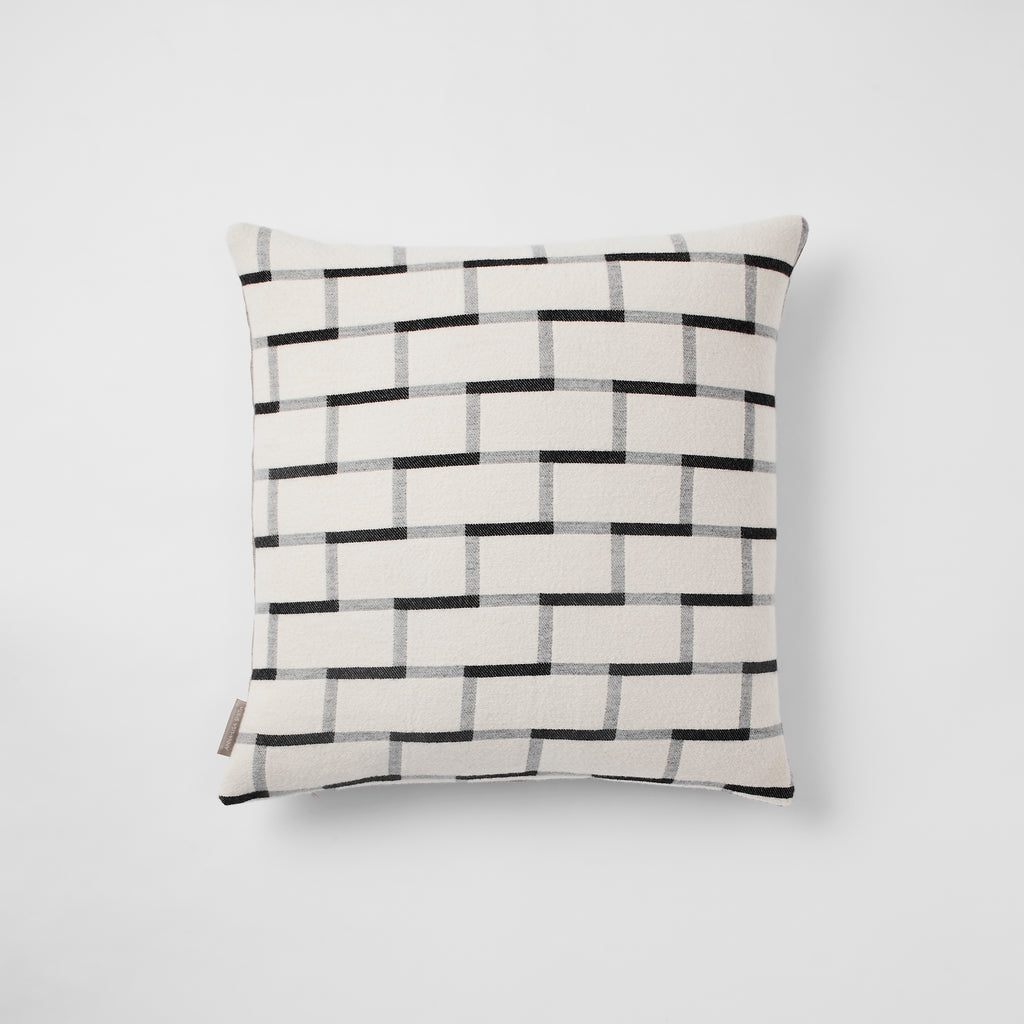 Contemporary, merino wool cushion. Geometric, monochrome design. Woven in England.