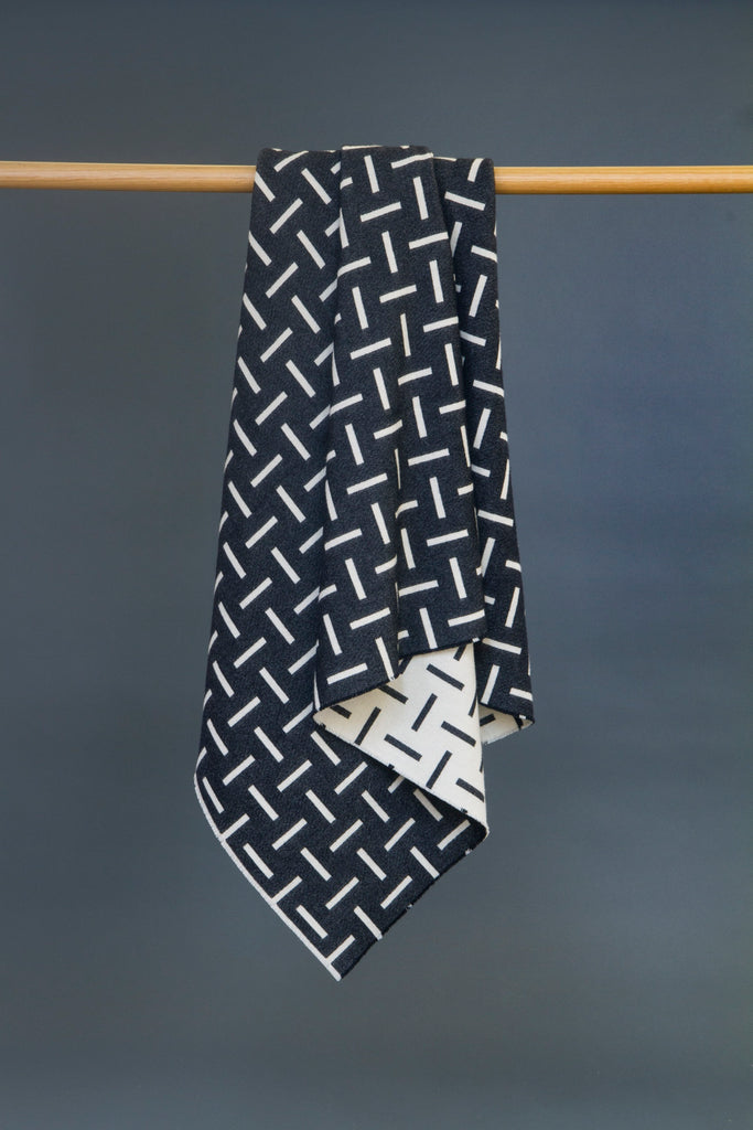 Monochrome, merino wool blanket. Contemporary, geometric design. Woven in England.