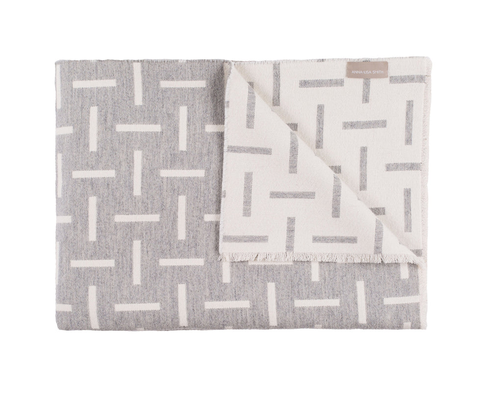 Grey  merino wool blanket. Contemporary, geometric design. Woven in England.